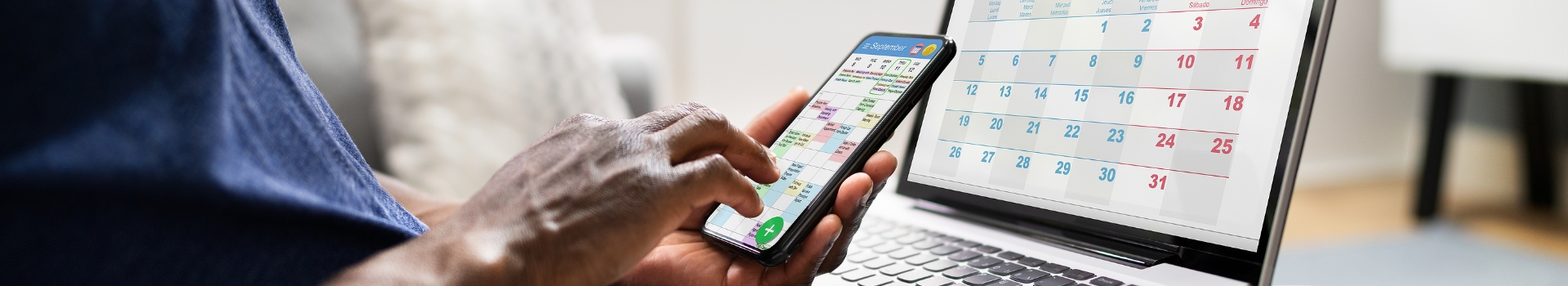 person on phone looking at calender
