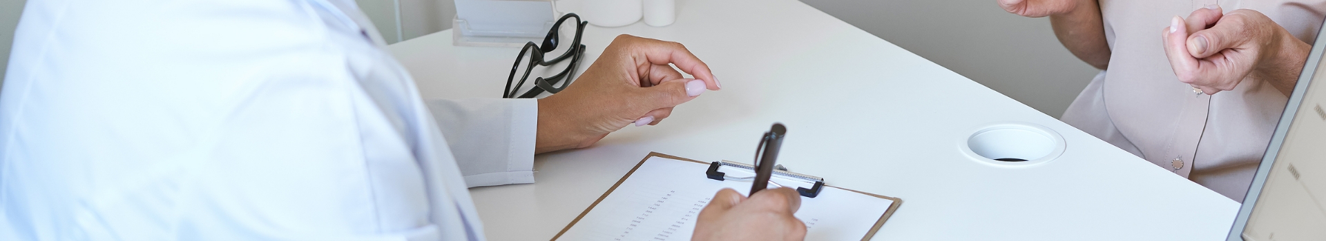 doctor writing down patient information